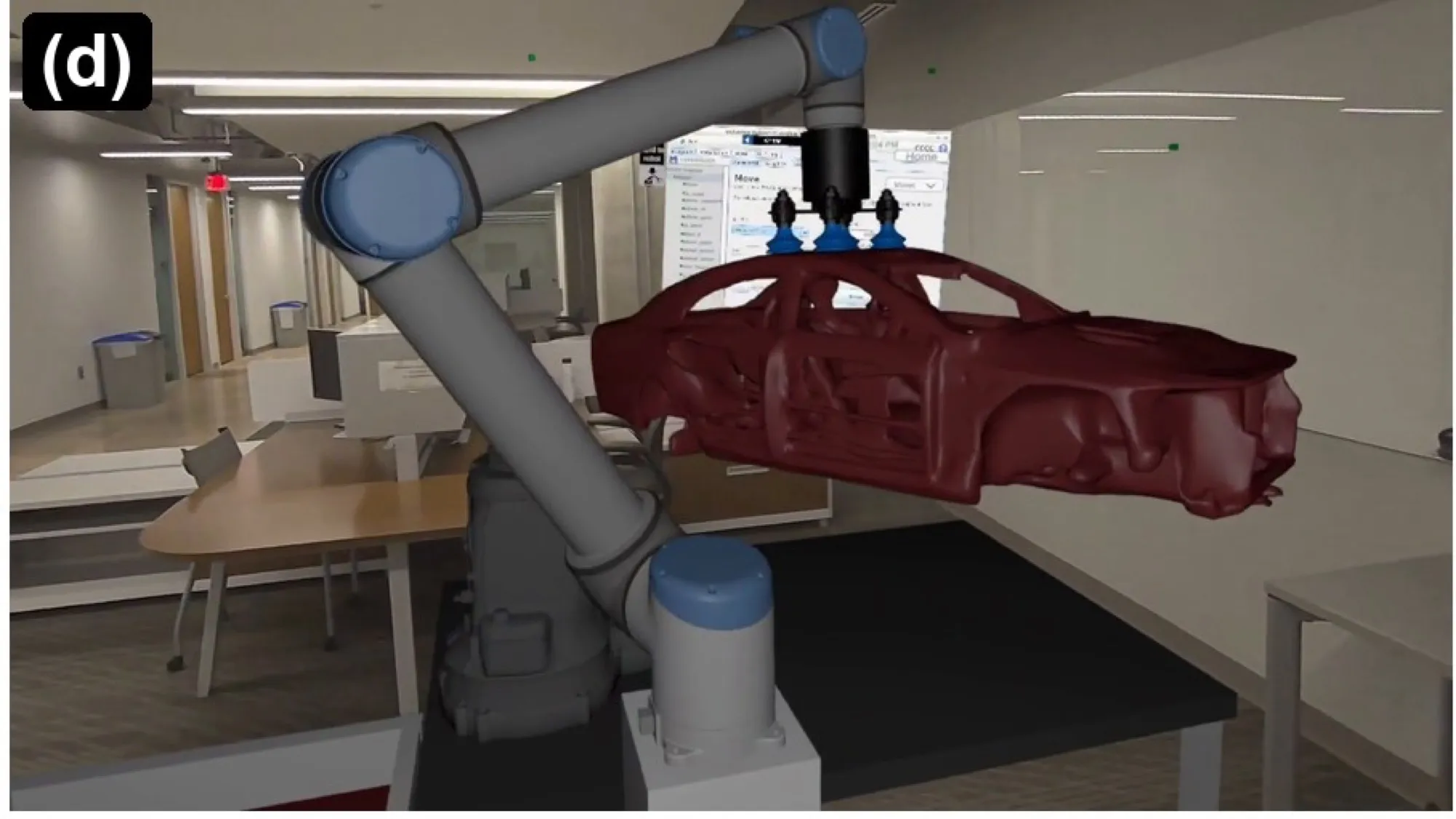 A virtual car body held by the robot arm, with programming panels floating beside it.
